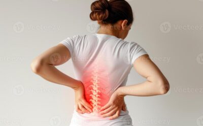 Person sitting with poor posture on laptop at home causing back and neck pain