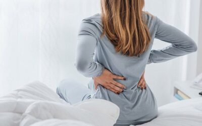 Can Your Mattress Cause Back Pain? – Expert Advice by Dr. Vishal Patil Person experiencing lower back pain due to an unsupportive mattress